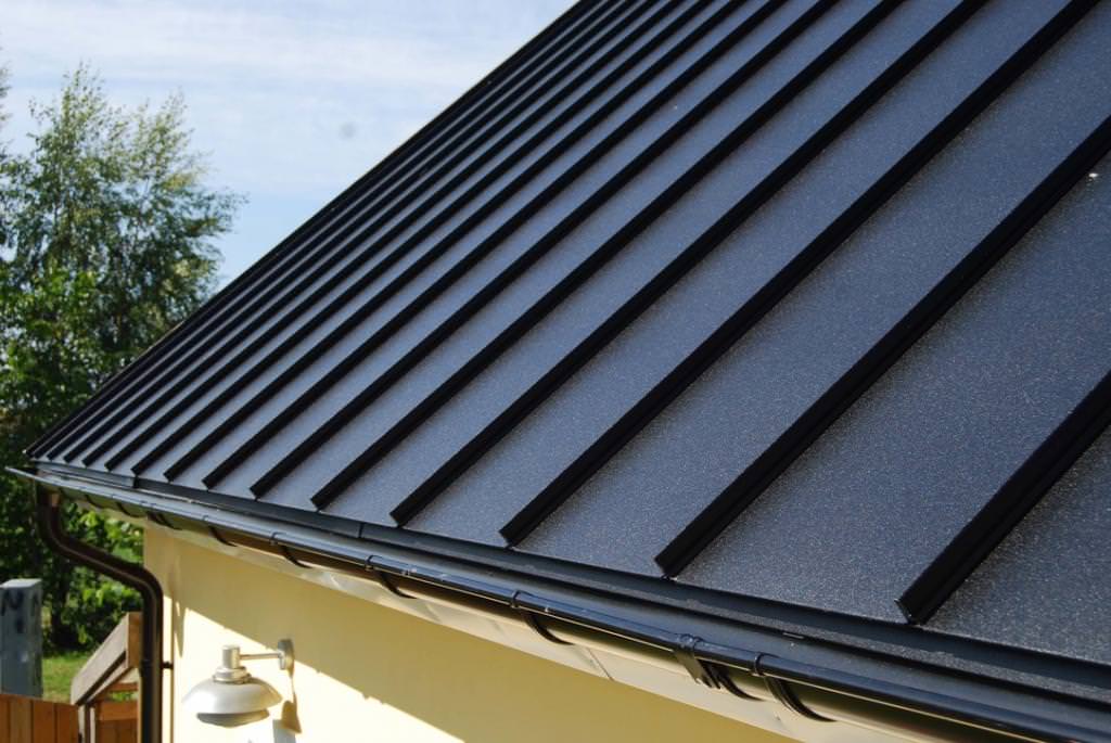 7. Omla╠eggning av takpannepla╠et pa╠e garage